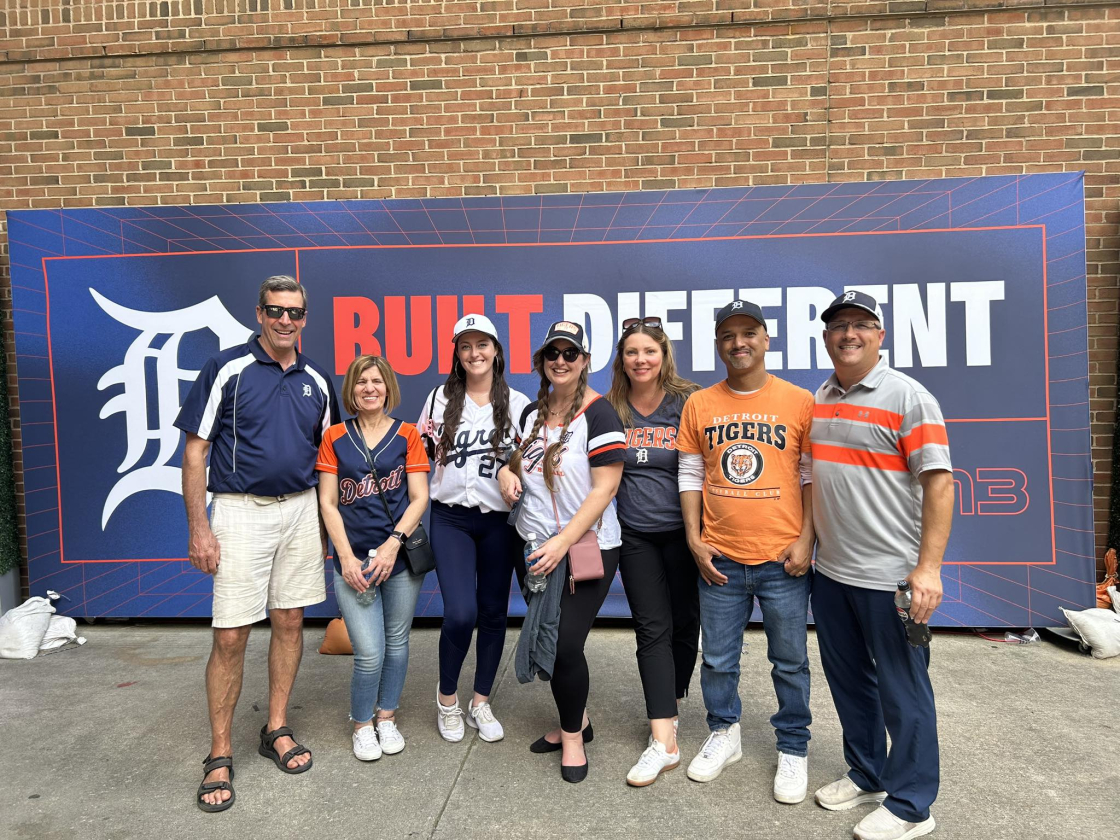 group standing in front of Detroit Tiger's Stadium