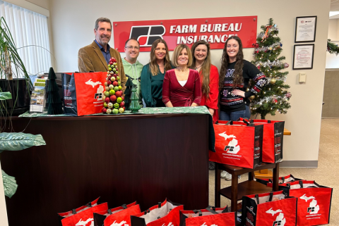 group standing with bags of food